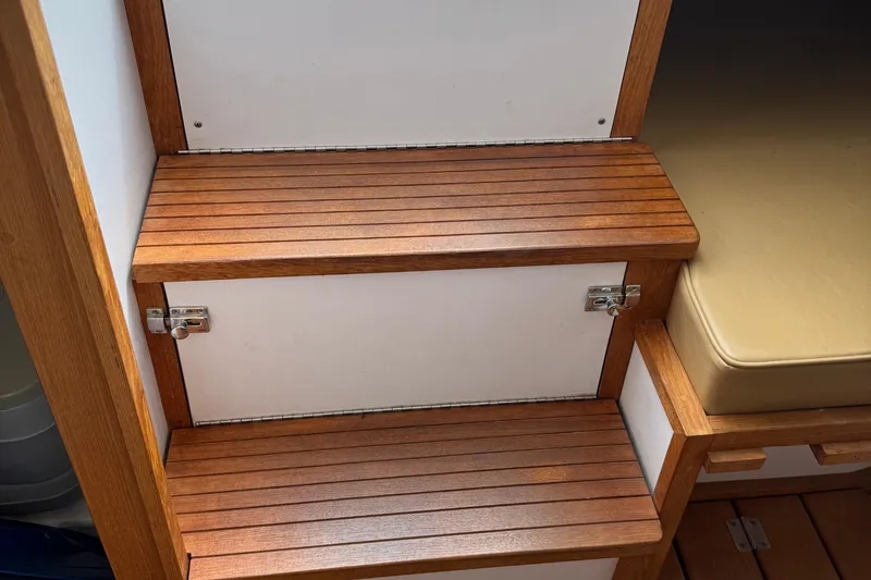 Slide: The Image of Wooden interior steps on a 2022 Com-Pac CP 23 Pilothouse boat. - 23