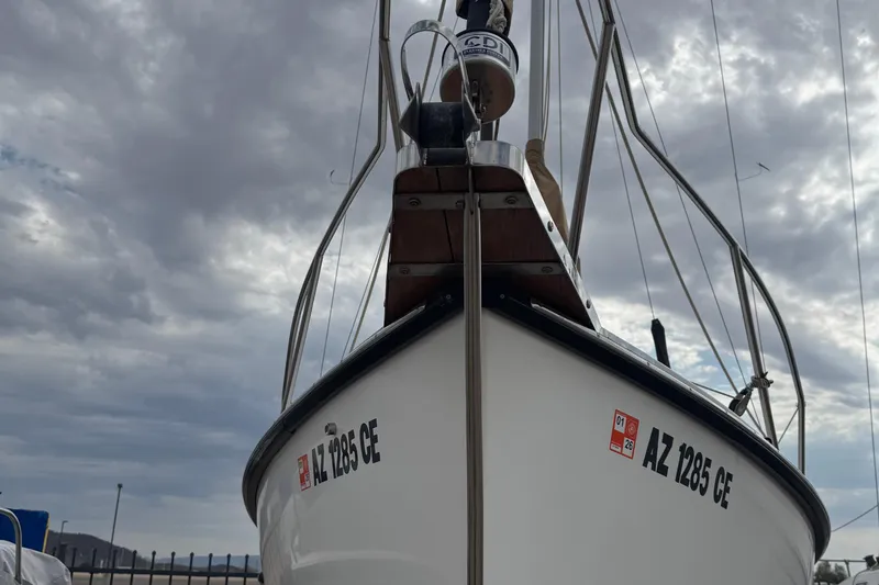 Slide: The Image of 2022 Com-Pac CP 23 Pilothouse sailboat under cloudy sky, front view. - 30