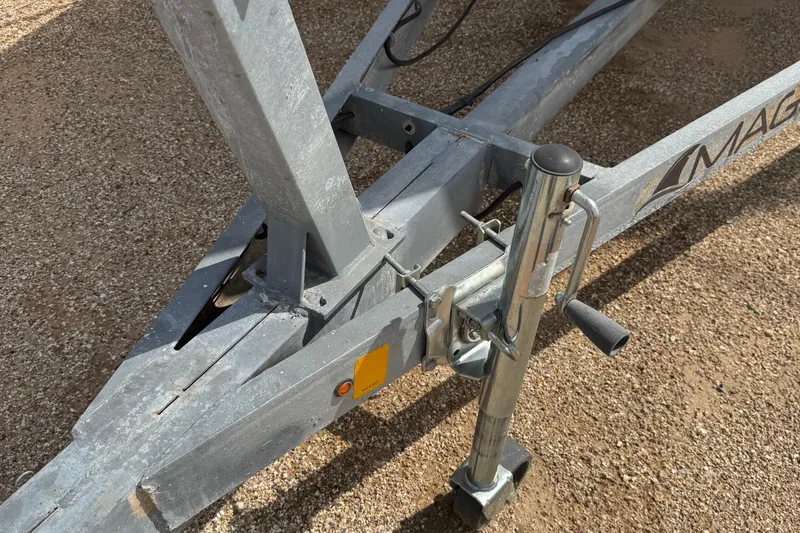 Slide: The Image of Trailer hitch of a 2022 Com-Pac CP 23 Pilothouse on gravel surface. - 31