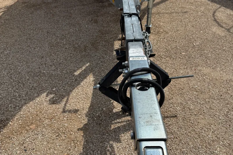Slide: The Image of Trailer hitch of 2022 Com-Pac CP 23 Pilothouse on gravel surface. - 32