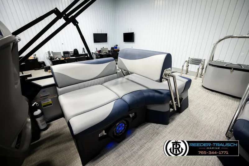 Slide: The Image of Luxurious 2026 Avalon LSZ QLS boat interior with plush seating in a modern showroom. - 21