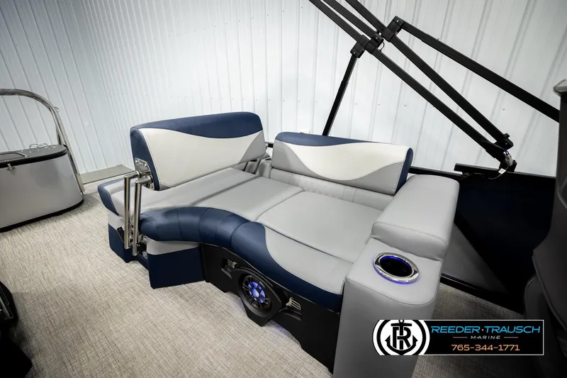 Slide: The Image of 2026 Avalon LSZ QLS boat interior with blue and gray seating, cup holder, and modern design. - 24
