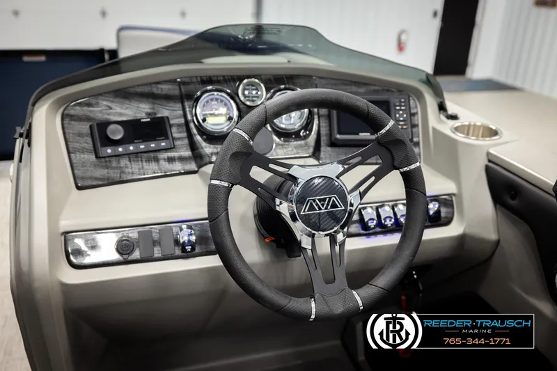 Slide: The Image of Steering wheel and dashboard of 2026 Avalon LSZ QLS boat, featuring modern controls. - 33