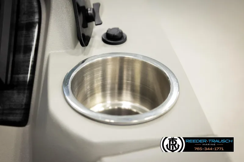 Slide: The Image of Cup holder on 2026 Avalon LSZ QLS boat console, Reeder-Trausch Marine logo visible. - 39