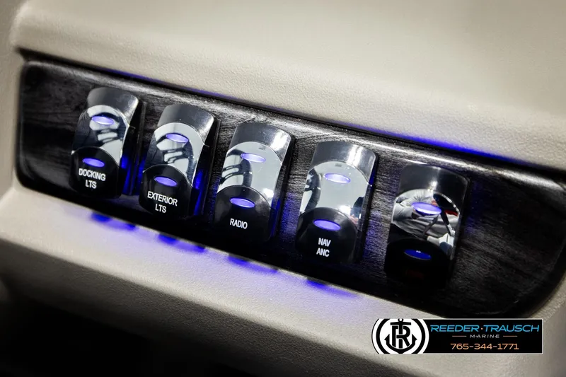 Slide: The Image of Control panel of 2026 Avalon LSZ QLS with illuminated switches for docking, exterior lights, and radio. - 40