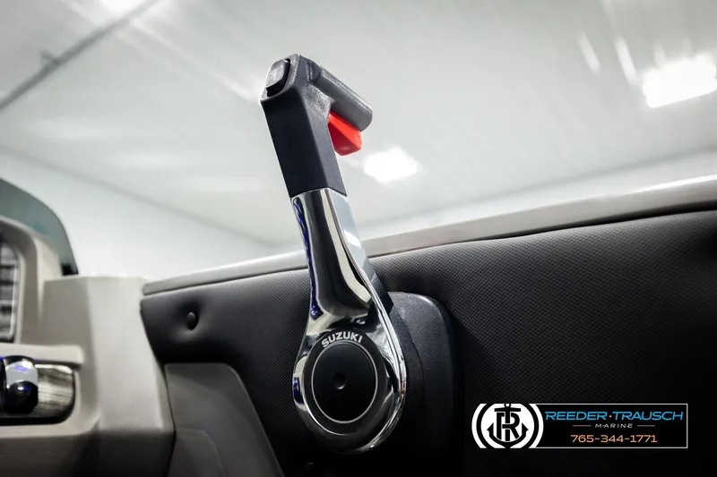 Slide: The Image of Avalon LSZ QLS 2026 boat throttle control with Suzuki branding in a modern interior. - 41