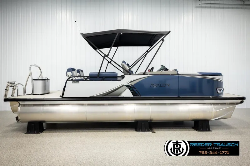 Slide: The Image of 2026 Avalon LSZ QLS pontoon boat with canopy in showroom setting. - 5