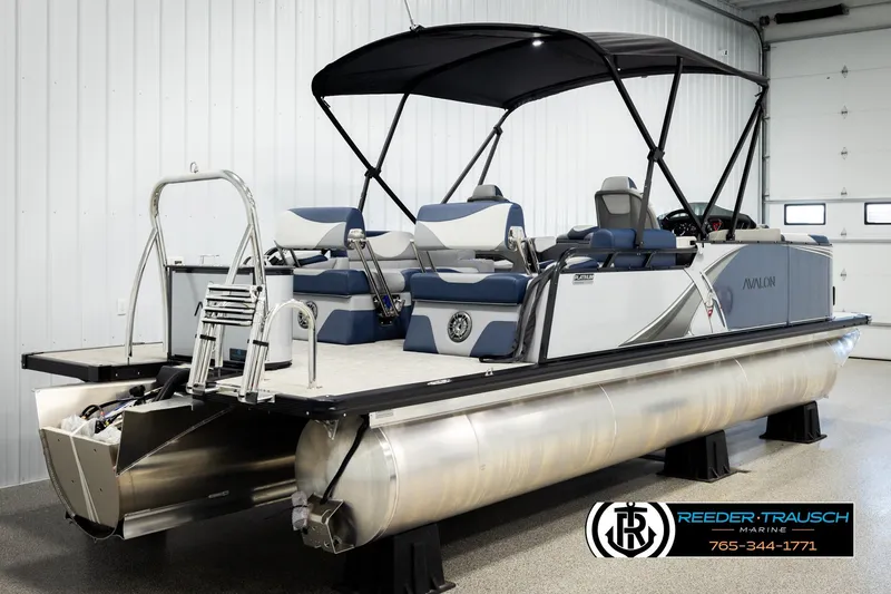 Slide: The Image of 2026 Avalon LSZ QLS pontoon boat with canopy in showroom setting. - 6