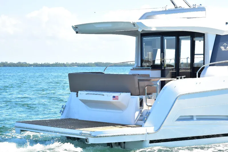 Slide: The Image of 2022 Sealine C430 yacht cruising on open water, rear view. - 21