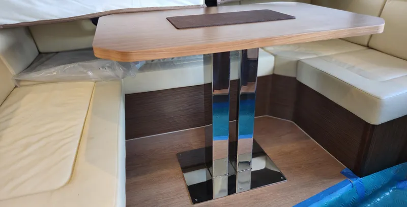 Slide: The Image of Modern interior of 2022 Sealine C430 yacht with sleek table and cushioned seating. - 37