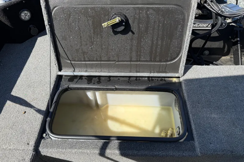 Slide: The Image of Open storage compartment in 2019 Alumacraft Competitor 185 CS boat. - 10