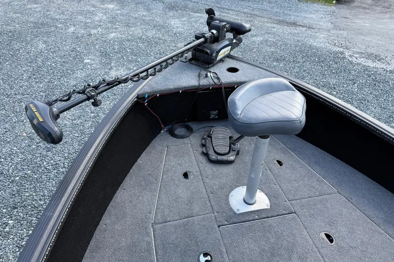 Slide: The Image of 2019 Alumacraft Competitor 185 CS boat interior with trolling motor and swivel seat. - 17