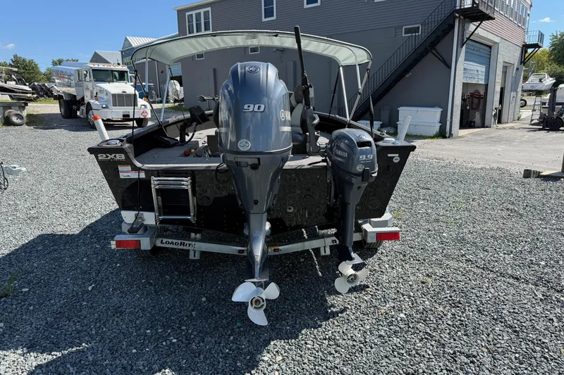 Slide: The Image of 2019 Alumacraft Competitor 185 CS boat with dual Yamaha outboard motors. - 3