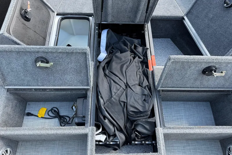 Slide: The Image of 2019 Alumacraft Competitor 185 CS boat storage compartments with gear and accessories. - 9