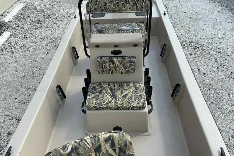 Slide: The Image of 2026 Carolina Skiff E18 JVX TH boat interior with camouflage seating design. - 6