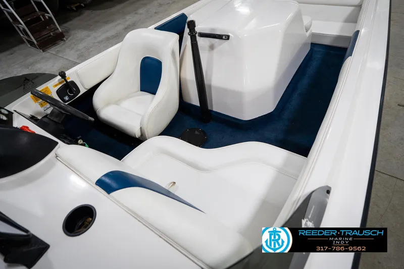 Slide: The Image of 1997 Moomba Boomerang boat on trailer in indoor showroom. - 11