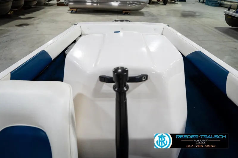 Slide: The Image of 1997 Moomba Boomerang boat interior with steering wheel and dashboard in a garage setting. - 17