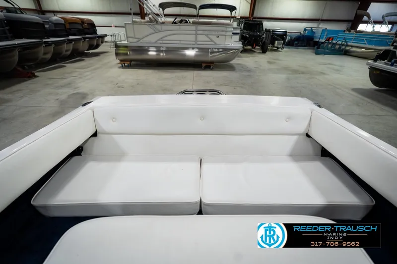 Slide: The Image of 1997 Moomba Boomerang boat interior with white and blue seating. - 18
