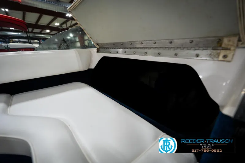 Slide: The Image of 1997 Moomba Boomerang boat interior with white and blue seating. - 20