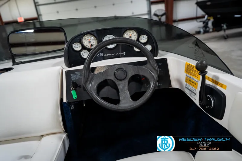 Slide: The Image of 1997 Moomba Boomerang boat dashboard with steering wheel and instrument panel. - 22