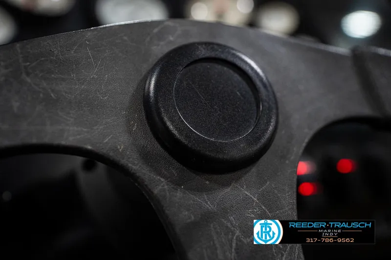 Slide: The Image of 1997 Moomba Boomerang boat dashboard with steering wheel and instrument panel. - 23