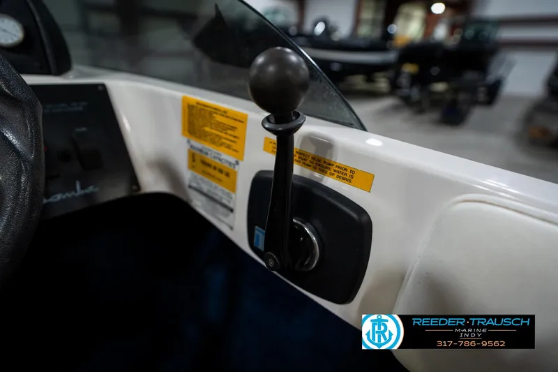 Slide: The Image of 1997 Moomba Boomerang dashboard with switches for navigation, accessories, and horn. - 29