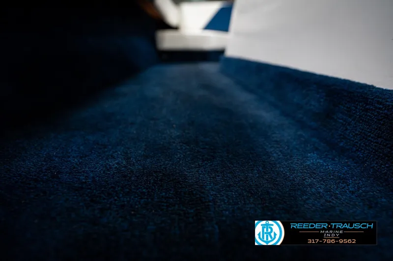 Slide: The Image of Cup holder in 1997 Moomba Boomerang boat, black plastic on white surface. - 36