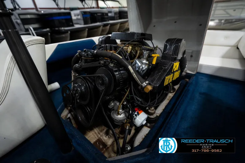 Slide: The Image of Interior carpet of a 1997 Moomba Boomerang boat, featuring blue upholstery. - 37