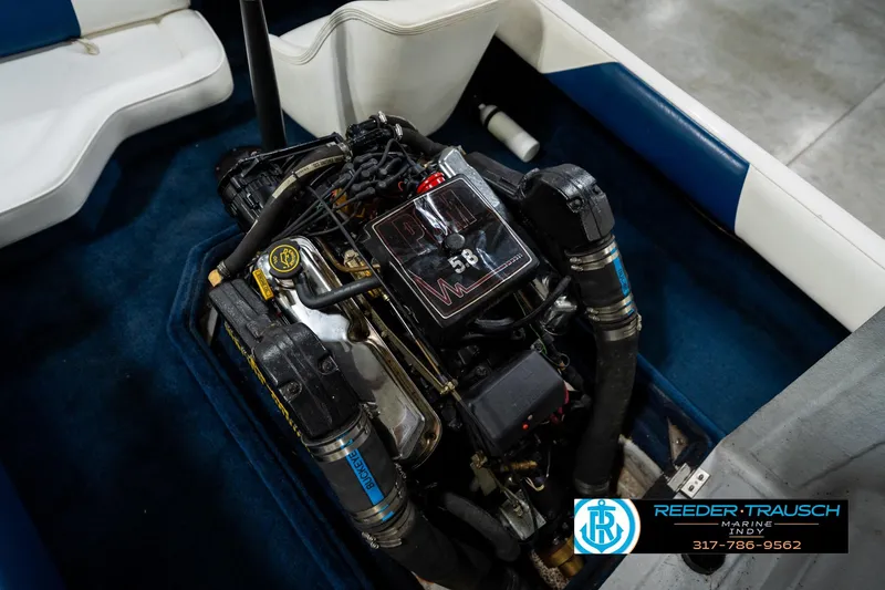 Slide: The Image of 1997 Moomba Boomerang boat engine with open compartment, showcasing mechanical components. - 38