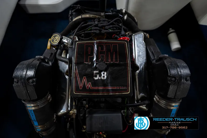 Slide: The Image of 1997 Moomba Boomerang boat engine, 5.8L, in a blue and white interior. - 39