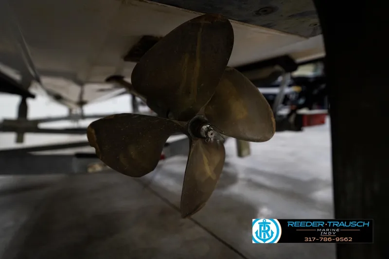 Slide: The Image of 1997 Moomba Boomerang boat propeller and rudder in a garage setting. - 41