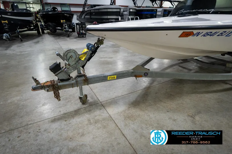 Slide: The Image of Close-up of a 1997 Moomba Boomerang boat propeller in a garage setting. - 42