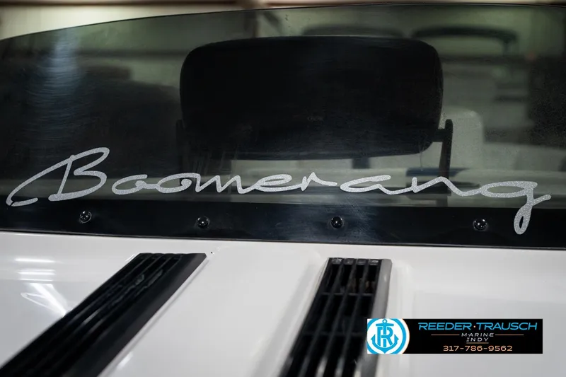 Slide: The Image of 1997 Moomba Boomerang logo on a boat's black surface. - 45