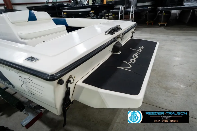 Slide: The Image of 1997 Moomba Boomerang boat windshield with logo in focus. - 46