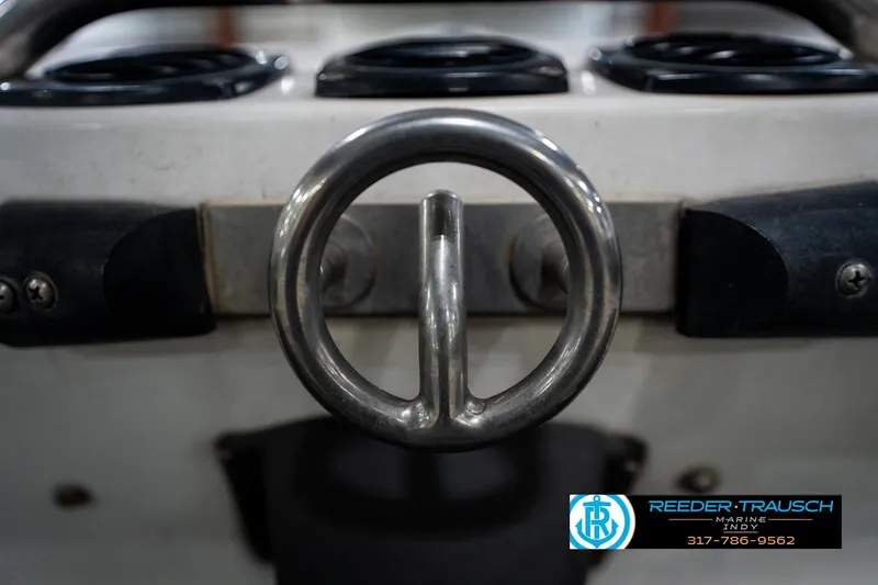 Slide: The Image of 1997 Moomba Boomerang boat rear view with swim platform in a showroom. - 47