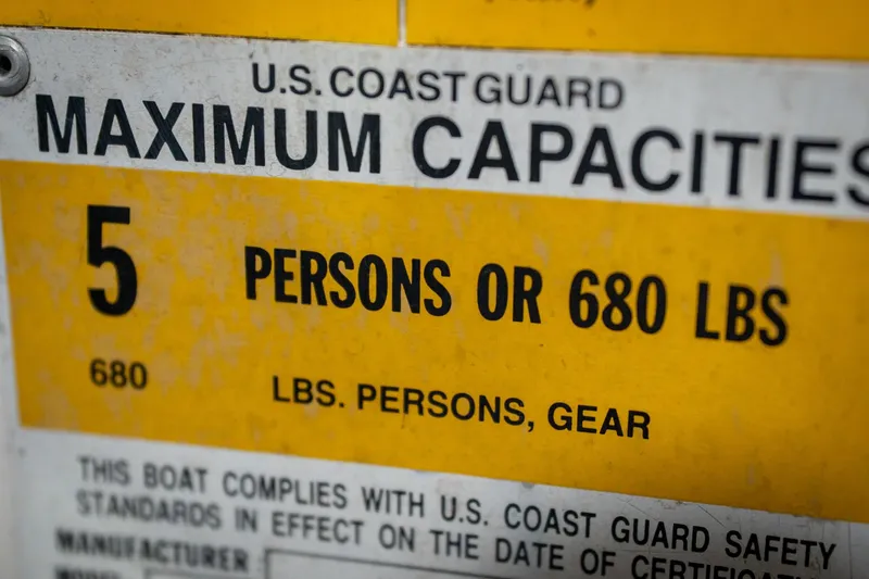 Slide: The Image of 1997 Moomba Boomerang capacity label: 5 persons or 680 lbs limit. - 49