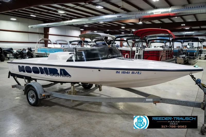Slide: The Image of 1997 Moomba Boomerang boat on trailer in indoor storage facility. - 5
