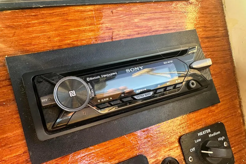 Slide: The Image of Sony stereo system in 2007 Duffy 22 Electric boat dashboard, featuring Bluetooth and SiriusXM. - 10