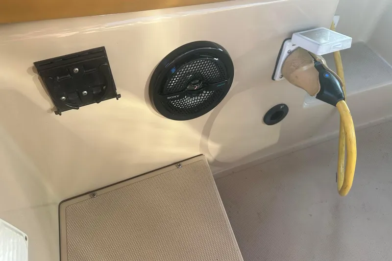 Slide: The Image of Interior of 2007 Duffy 22 Electric boat with speaker and power connection. - 11