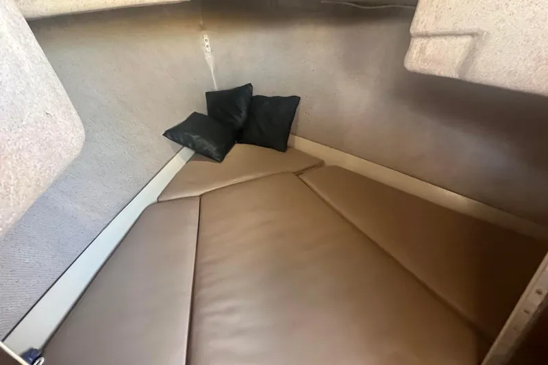 Slide: The Image of 2007 Duffy 22 Electric boat interior cabin with cushions and beige upholstery. - 18