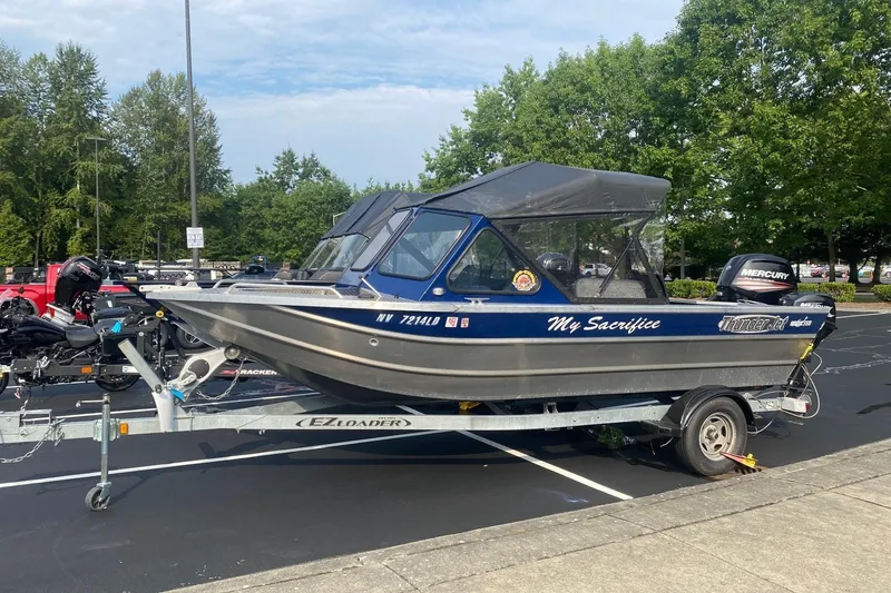 The Image of 2016 Thunder Jet V-186 Eco boat on trailer in parking lot. - 1
