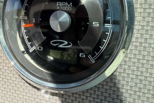 Slide: The Image of Close-up of a 2014 Regal 2500 Bowrider RPM gauge displaying 615. - 11
