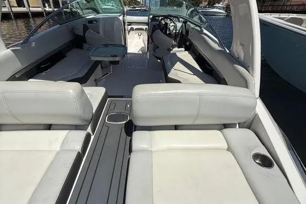 Slide: The Image of 2014 Regal 2500 Bowrider boat interior with white seating and sleek design. - 8