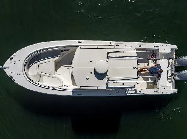 Slide: The Image of Overhead view of 2010 Edgewater 318CC boat on water. - 10