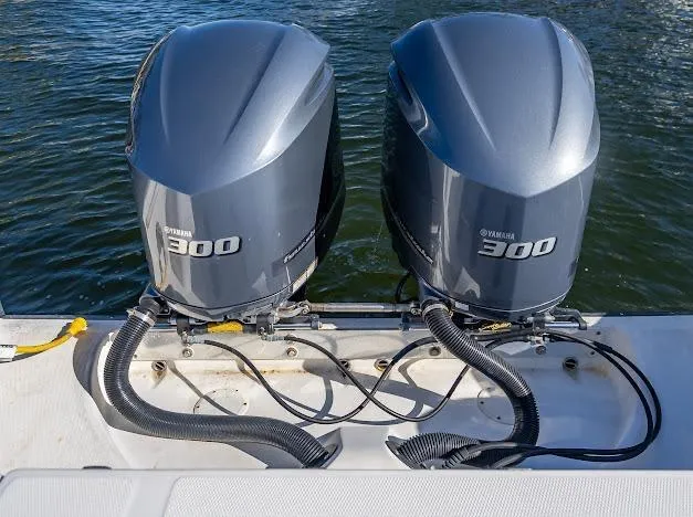 Slide: The Image of Twin Yamaha 300 outboard engines on a 2010 Edgewater 318CC boat. - 30