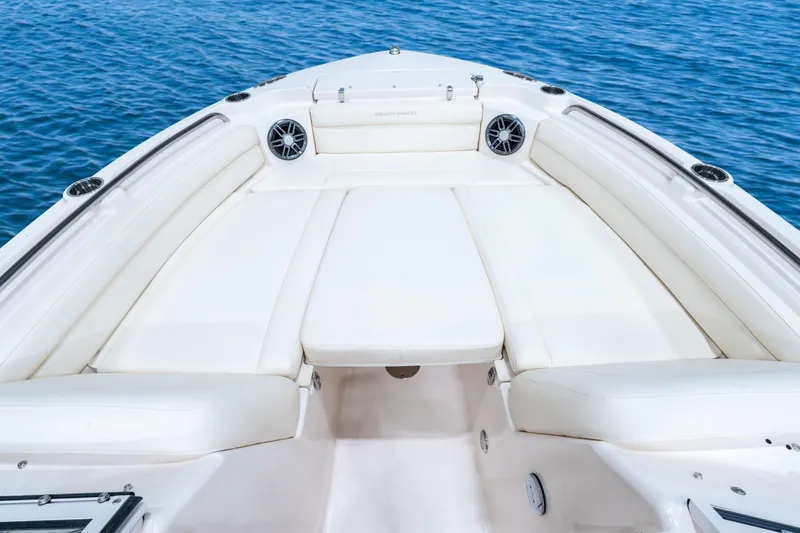Slide: The Image of 2026 Grady-White Freedom 215 boat interior with white seating and ocean backdrop. - 9
