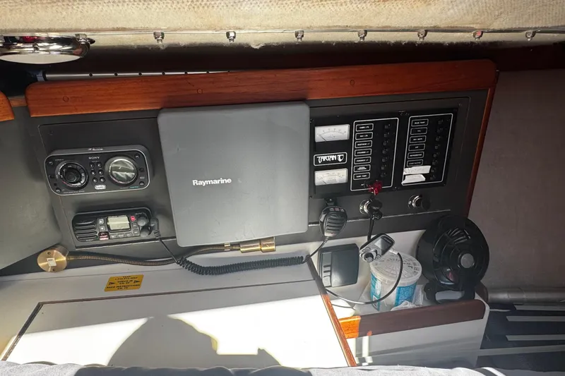 Slide: The Image of Control panel of a 1990 Tartan Thomas 35 sailboat with navigation and communication equipment. - 15