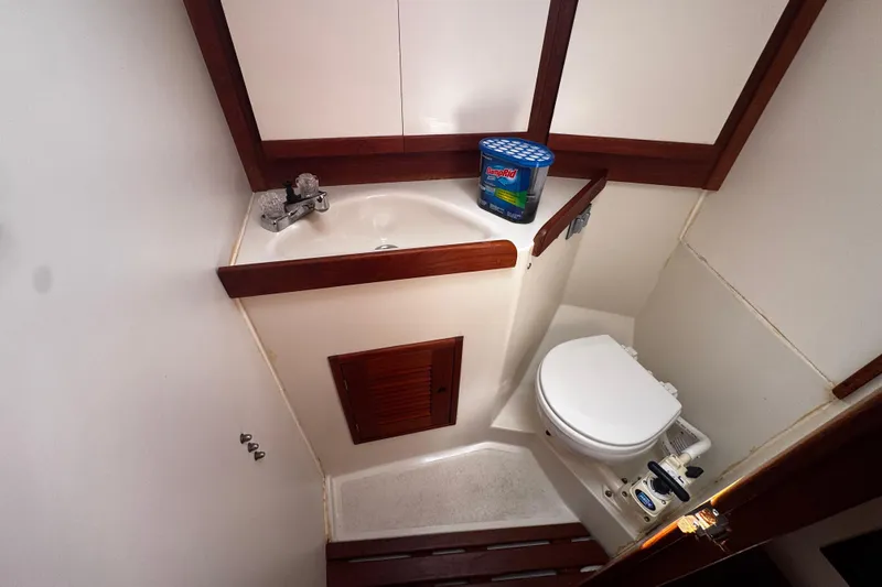 Slide: The Image of Compact bathroom in 1990 Tartan Thomas 35 yacht with sink and toilet. - 30