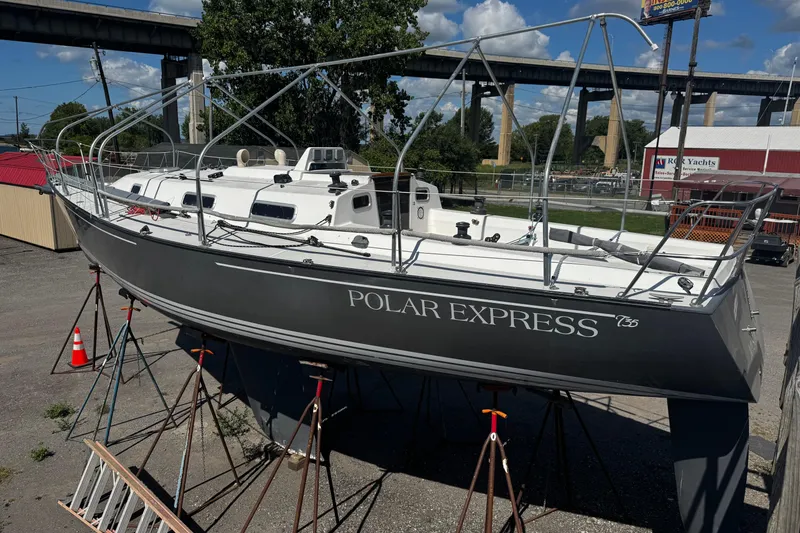Slide: The Image of Sailboat "Polar Express" Tartan Thomas 35, 1990 model, on stands in a boatyard. - 32