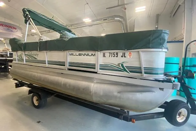 Slide: The Image of 2001 Odyssey Pontoons 1703 Millennium boat on trailer in indoor storage. - 1